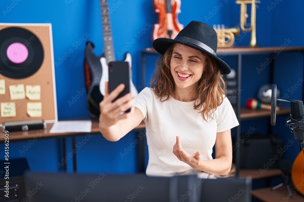 Sticker young woman musician having video call at music studio