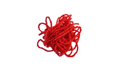 Red thread isolate on white background. Selective focus.
