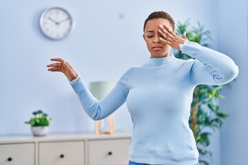 African american woman suffering dizzy standing at home