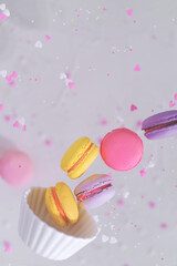 pastel pink colors macaroons levitating with hearts decor