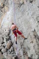 A cliff-climber at Railay Beach  Thailand