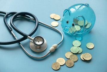 Concept of saving for Medical insurance costs or expense and financial checkup. Transparent piggy...