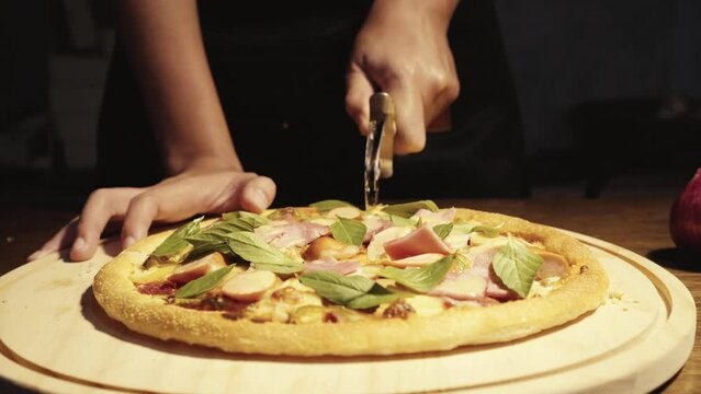 Close up homemade pizza on the table, fast food cooking in the kitchen at home, Food Fottage Clip.