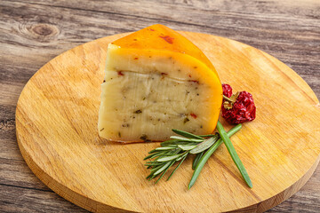 Hard cheese with dry tomato
