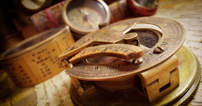 Vintage style travel and adventure. Vintage old compass and other vintage items on the table.