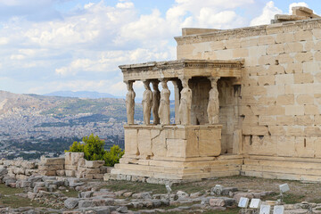 The Porch of the Maidens, the Erechtheion, Athenian Acropolis and panorama of Greek capital Athens....