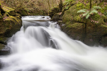Long exposure of a waterfall on the East Lyn river at Watersmeet in Exmoor National Park