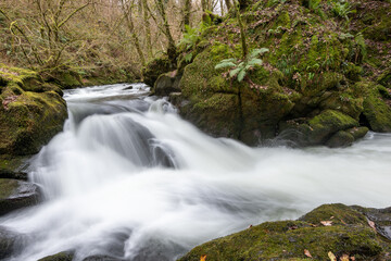 Long exposure of a waterfall on the East Lyn river at Watersmeet in Exmoor National Park