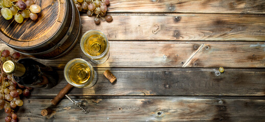 Wine background. White wine in an old barrel.