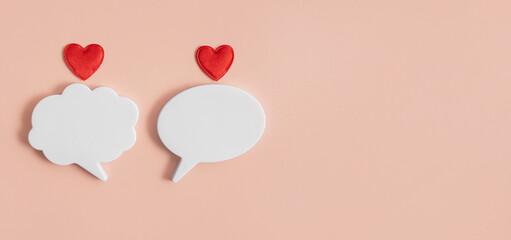 Chat icons with hearts on a light background. The concept of modern love. Valentine's Day. Long...