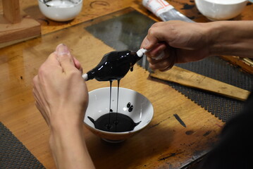 Filtration of Japanese lacquer urushi to remove dust particles - preparation of raw material to...