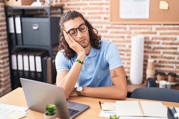 Young hispanic man business worker sleeping at office