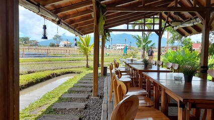 Gazebo with table and chairs by the rice fields