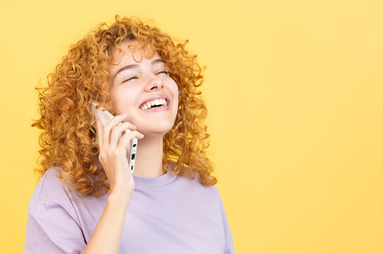 Woman Talking To The Mobile While Smiling With Eyes Closed