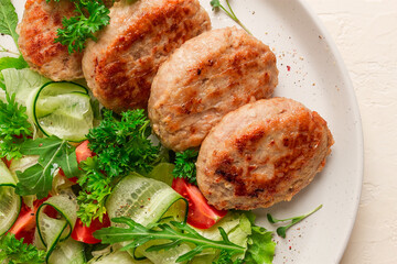 Fried cutlets, turkey, with vegetable salad, top view, no people,