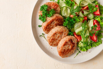 Fried cutlets, turkey, with vegetable salad, top view, no people,