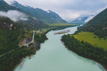 Altai mountains summer Russia, aerial top view. Blue Katun river with fog mood