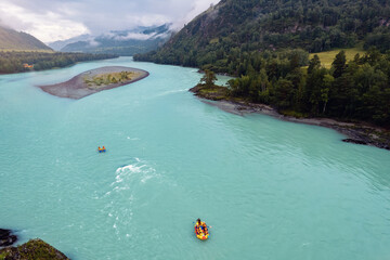 Team extreme rafting on red boat on stormy blue river Altai, Aerial top view. Concept adventure travel
