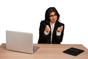 Young indian woman in a table with a laptop and tablet isolated showing that she has no money.