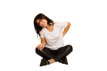 Young indian woman sitting on the floor cut out isolated suffering a back pain.