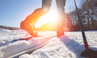 Banner Cross country skiing, winter sport on snowy track, sunset sun light background