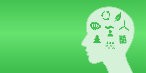 Environmental protection and green thinking in head as svg graphic. Green vector file with head silhouette with symbols for solar energy, CO2, wind power and resycling.