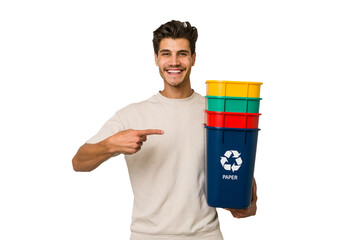 Young caucasian man holding recycling bins isolated on white background