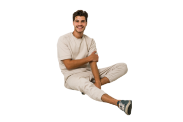 Young caucasian man sitting on the floor isolated on white background