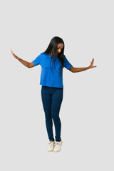 Young Indian woman standing isolated on white background