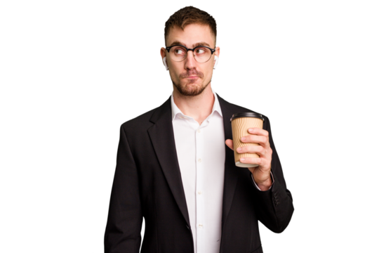 Young business caucasian man drinking a coffee isolated cutout confused, feels doubtful and unsure.