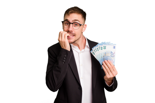 Young business caucasian man holding euro banknotes isolated cut out biting fingernails, nervous and very anxious.