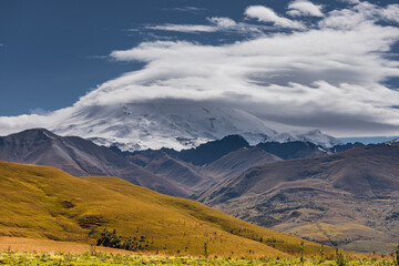 Fototapeta na wymiar A view on Elbrus mountain and Malka river valley. Dzhili-Su, Republic of Kabardino-Balkaria