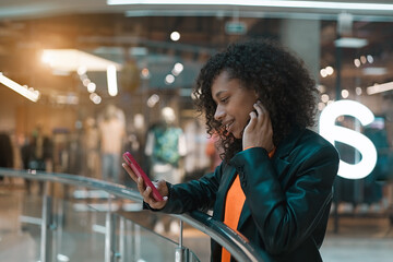 Young smiling african american girl walk in the mall  