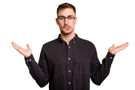 Young caucasian man cut out isolated confused and doubtful shrugging shoulders to hold a copy space.