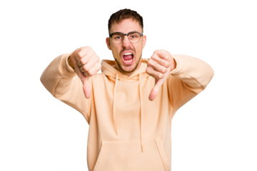 Young caucasian man cut out isolated showing thumb down and expressing dislike.