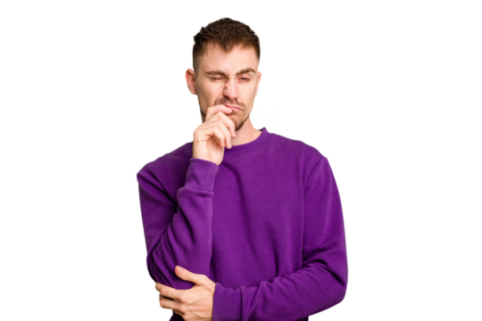 Young caucasian man cut out isolated thinking and looking up, being reflective, contemplating, having a fantasy.