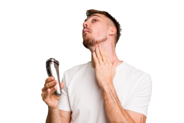 Young caucasian man using an electric shaver isolated cut out