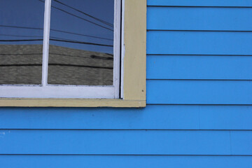Window on blue-painted home