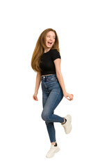 Young redhead woman jumping cut out isolated