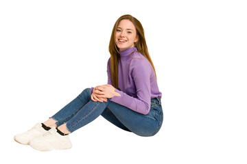 Young redhead woman sitting isolated cut out