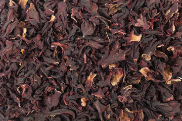 Dry hibiscus tea background.  Dry hibiscus tea filling the frame.herb. herbal tea. food ingredient.