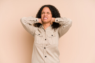 Young african american curly woman isolated suffering neck pain due to sedentary lifestyle.