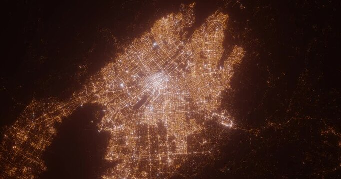 San Jose (California, USA) aerial view at night. Top view on modern city with street lights. Camera is zooming out, rotating counterclockwise. Vertical video. The north is on the left side
