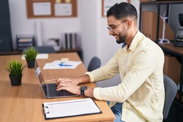Young arab man business worker using laptop working at office
