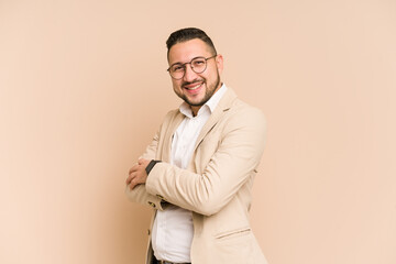 Fototapeta premium Adult latin business man cut out isolated who feels confident, crossing arms with determination.