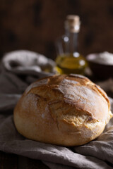 Homemade bread  and cloth napkin at wood table. Bakery concept and bread on wooden tabletop