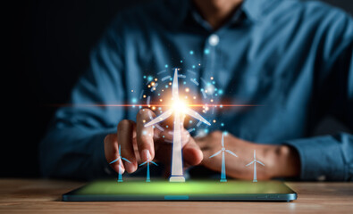 Energy engineer using tablet virtual wind turbine farm with map future, prototype design on holographic projection, Futuristic design with technology application basic, Green energy concept.