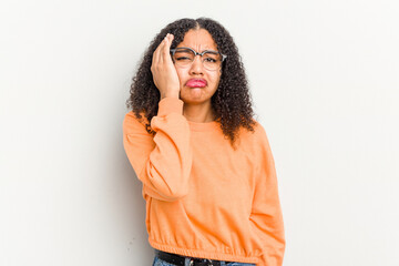 Young african american woman isolated on white background tired and very sleepy keeping hand on head.