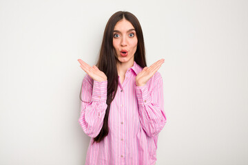 Young caucasian woman isolated on white background surprised and shocked.