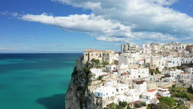 The medieval town center of Peschici on its steep cliff in Europe, Italy, Puglia, towards Foggia, in summer, on a sunny day.